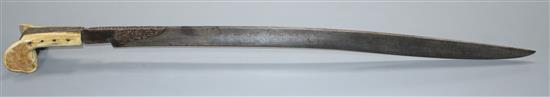 A Turkish sword Yataghan, with silver inlaid decoration and inscription, ivory grips, overall length 72cm